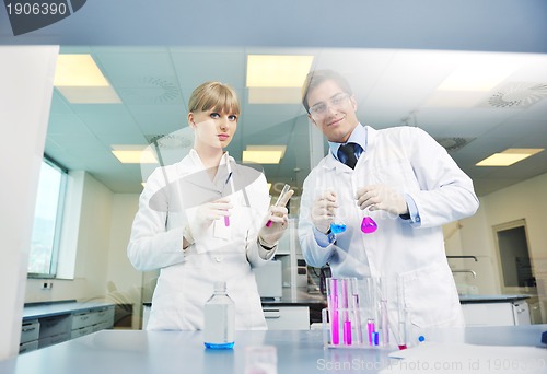 Image of science people in bright lab