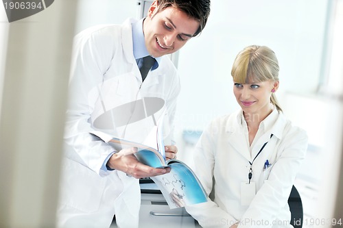 Image of science people in bright lab