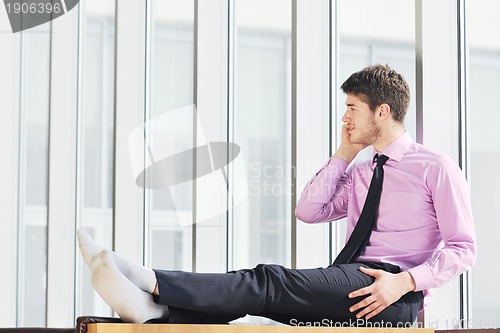 Image of young business man talk by cellphone