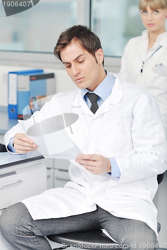 Image of science people in bright lab