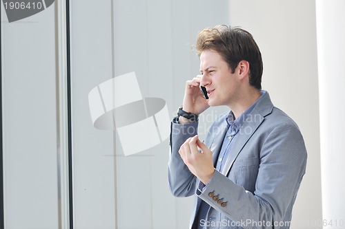 Image of young business man talk by cellphone