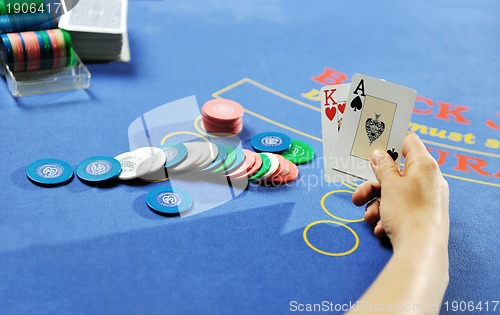 Image of woman play black jack card game in casino