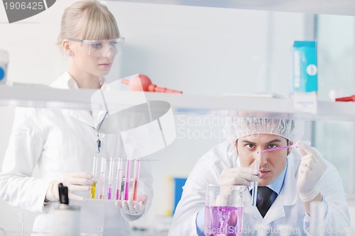 Image of science people in bright lab