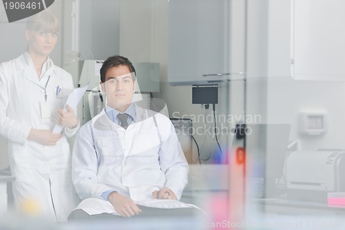 Image of science people in bright lab