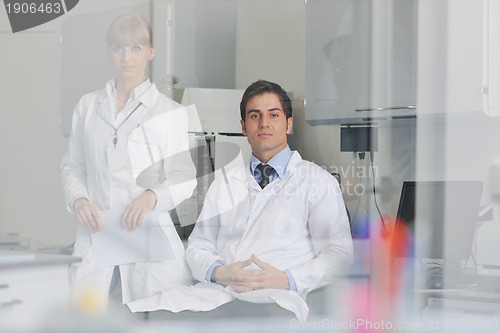 Image of science people in bright lab