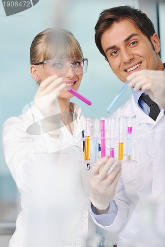 Image of science people in bright lab