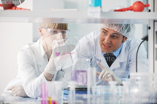 Image of science people in bright lab