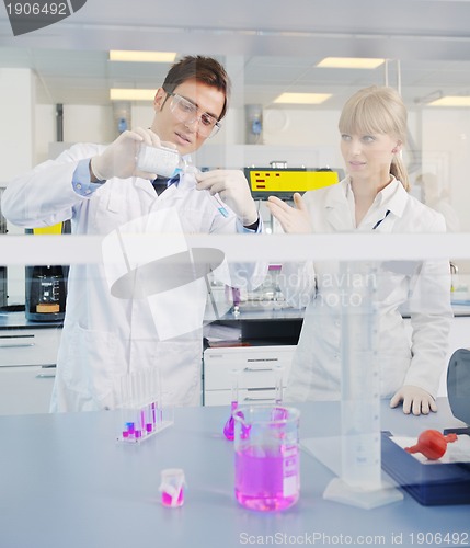 Image of science people in bright lab