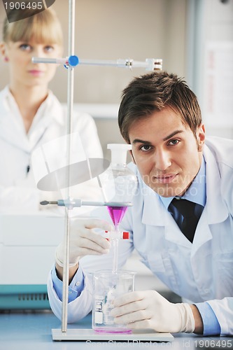 Image of science people in bright lab