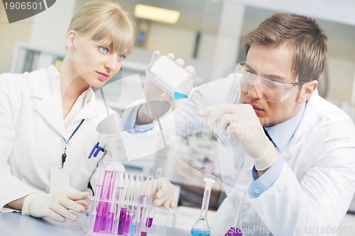 Image of science people in bright lab