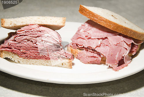 Image of combination corned beef tongue sandwich  Jewish rye bread at kos