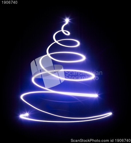 Image of Christmas tree with light and blue star.