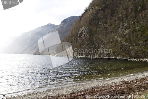 Image of fjord in norway with pebbly coast