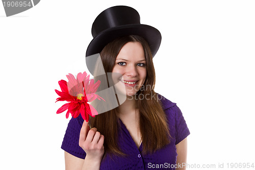 Image of Young woman with red flower