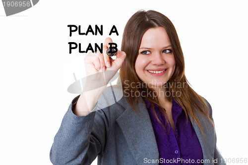 Image of Young woman writing a plan