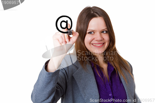 Image of Young woman writing an at