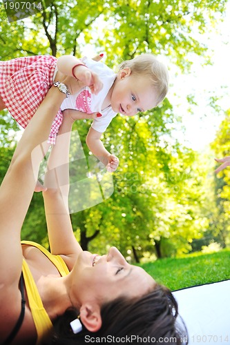 Image of woman and baby have playing at park