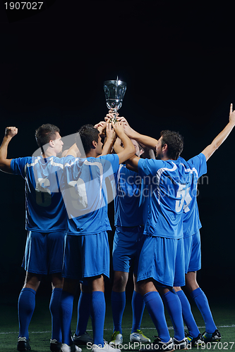 Image of soccer players celebrating victory