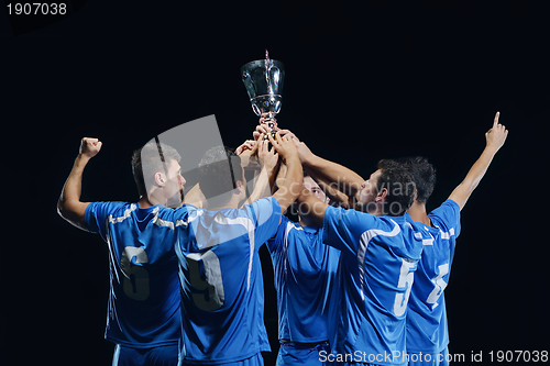 Image of soccer players celebrating victory