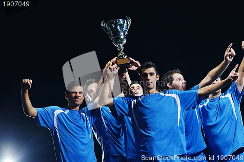 Image of soccer players celebrating victory