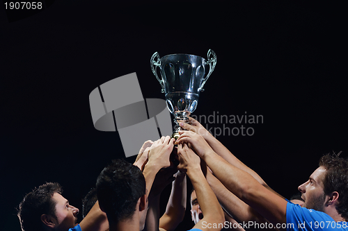 Image of soccer players celebrating victory