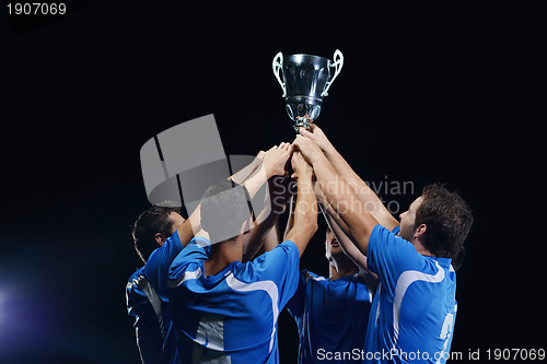 Image of soccer players celebrating victory