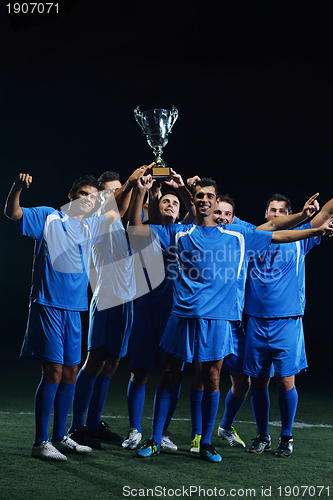 Image of soccer players celebrating victory