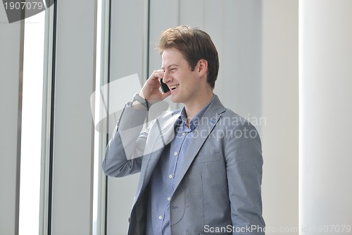 Image of young business man talk by cellphone