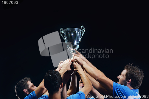 Image of soccer players celebrating victory