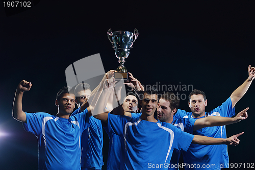 Image of soccer players celebrating victory