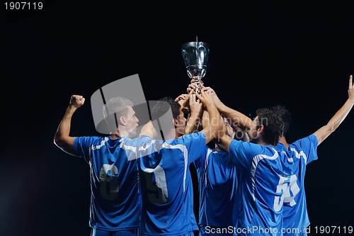 Image of soccer players celebrating victory