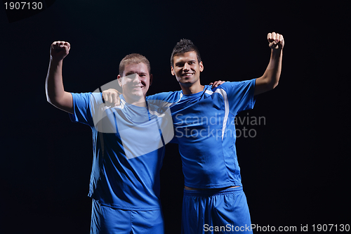 Image of soccer players celebrating victory