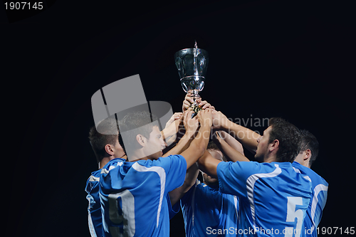 Image of soccer players celebrating victory