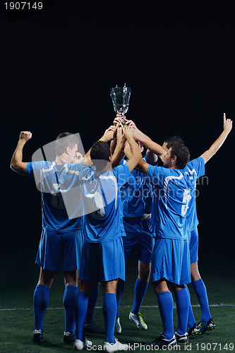 Image of soccer players celebrating victory