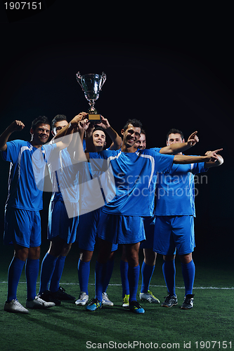 Image of soccer players celebrating victory
