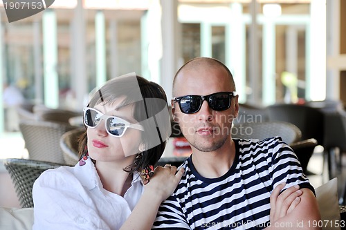 Image of happy young couple have fun on beach