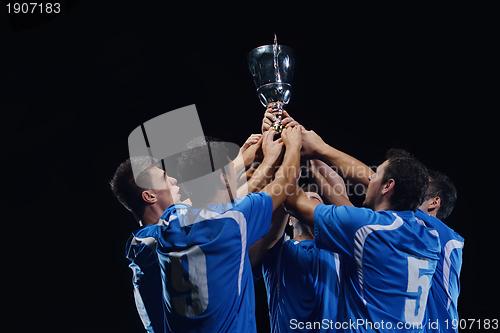Image of soccer players celebrating victory