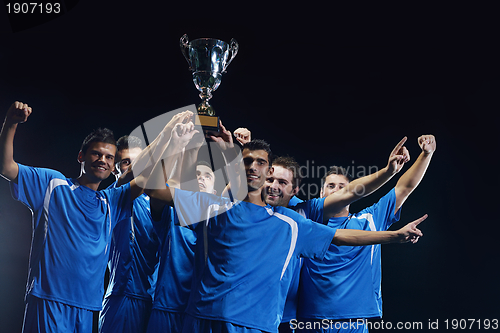 Image of soccer players celebrating victory