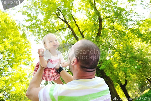 Image of man and baby playing in park