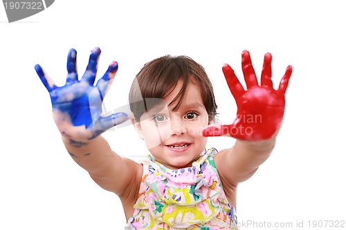 Image of beautiful little girl with her hands in the paint 