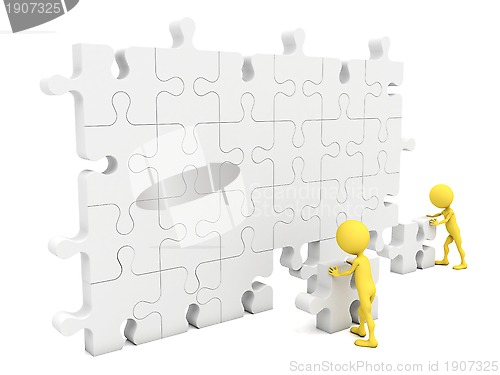 Image of Men putting on a wall a piece missing 