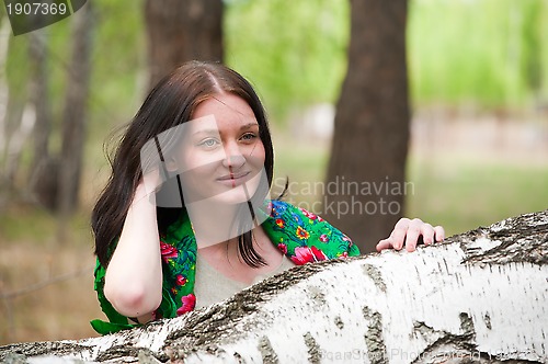 Image of Beautiful woman near birch