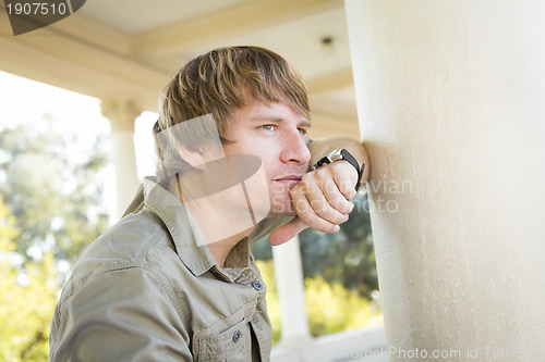 Image of Handsome Thinking Young Man Outside