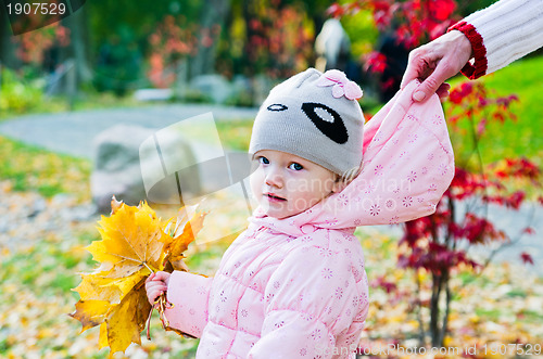 Image of grandmother with the grand daughter in autumn park