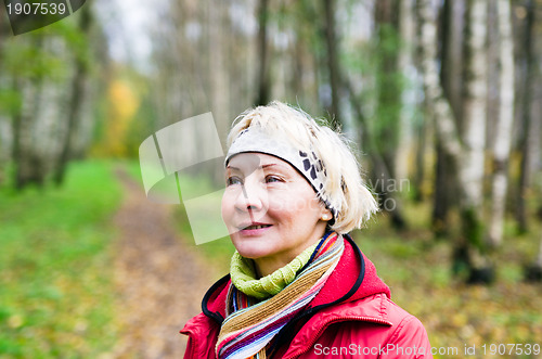 Image of a middle-aged woman in autumn Park