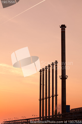 Image of Factory chimneys at sunrise