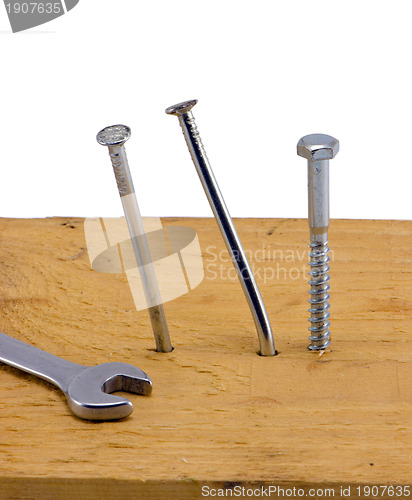 Image of nails hammered board bend screw bolt wrench white 