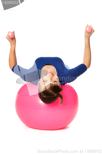 Image of Exercises with dumbbells on a gymnastic ball