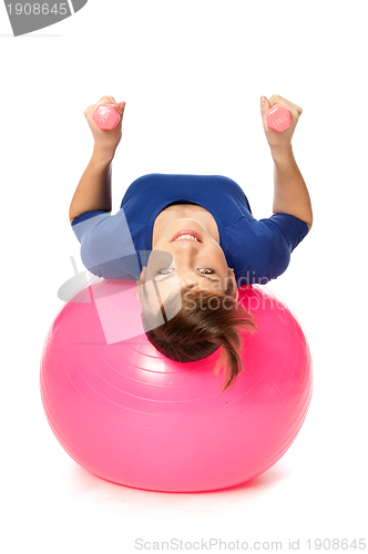 Image of Exercises with dumbbells on a gymnastic ball