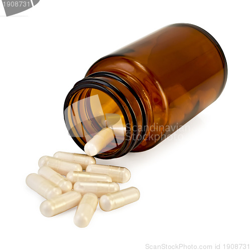 Image of Capsules in an open jar of brown